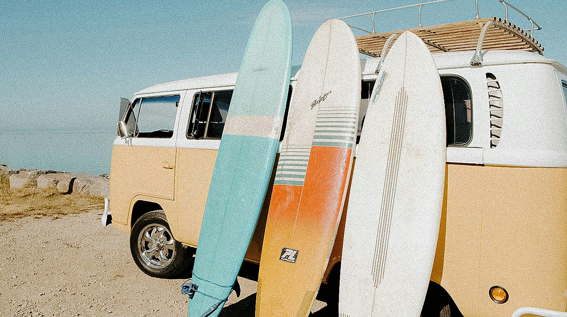 Surf van loaded with boards Load the boards — the journey is half the trip. Photo: Amanda Vick / Unsplash