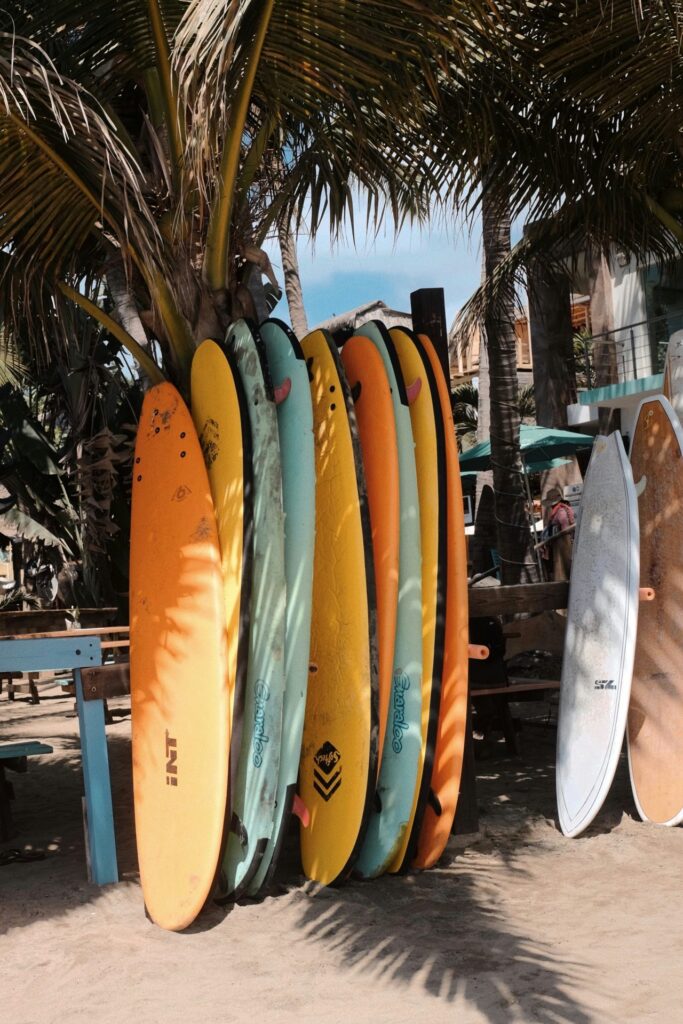 Colorful quiver of surfboards
Bring the right board — or rent one when you land. Photo: Alice Kotlyarenko / Unsplash